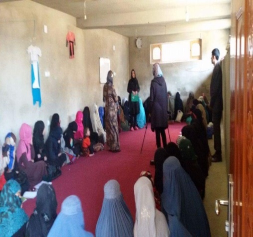 Women holding certificates after completing AWEVSO training